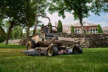 Mid-mount zero-turn lawn mower on grass 