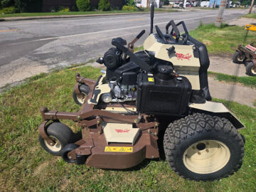 Grasshopper zero turn mower parked on grass