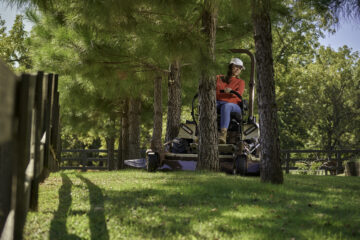 Commercial operator mowing a large Southern Illinois property with a Grasshopper mower