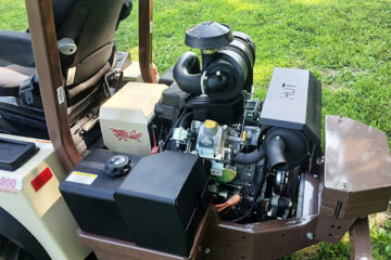 Grasshopper commercial mower with the engine compartment open, providing easy access for maintenance and repairs.